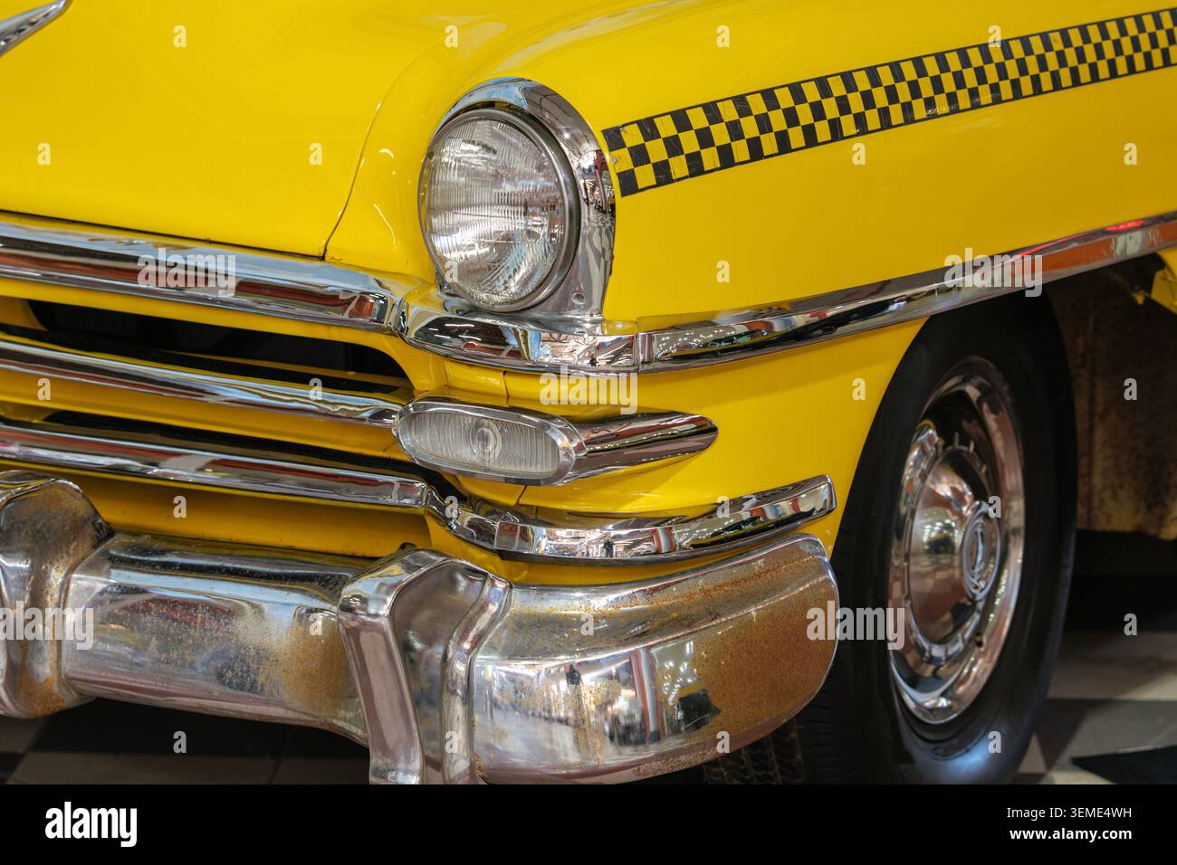Iconic vintage yellow checker taxi hi-res stock photography and