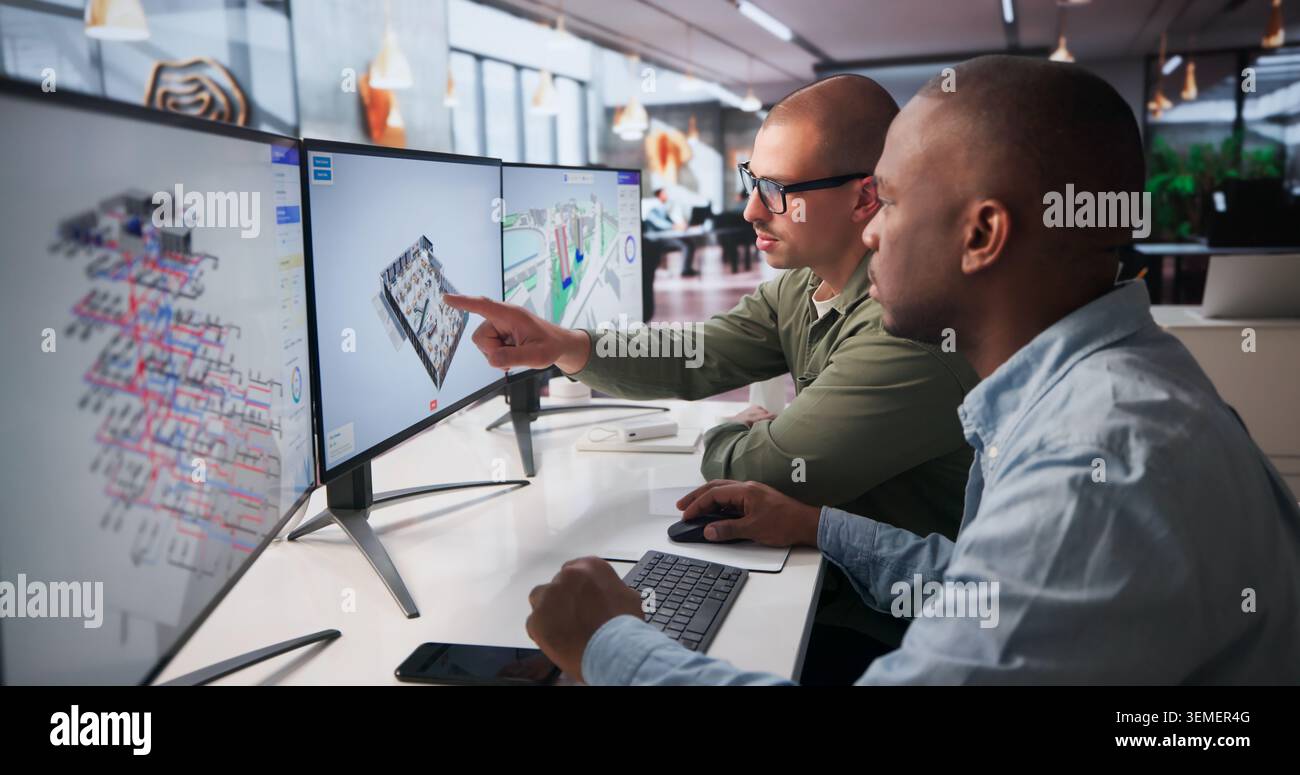 Two Engineers Collaborate On 3D BIM Software For Construction Planning. Stock Photo