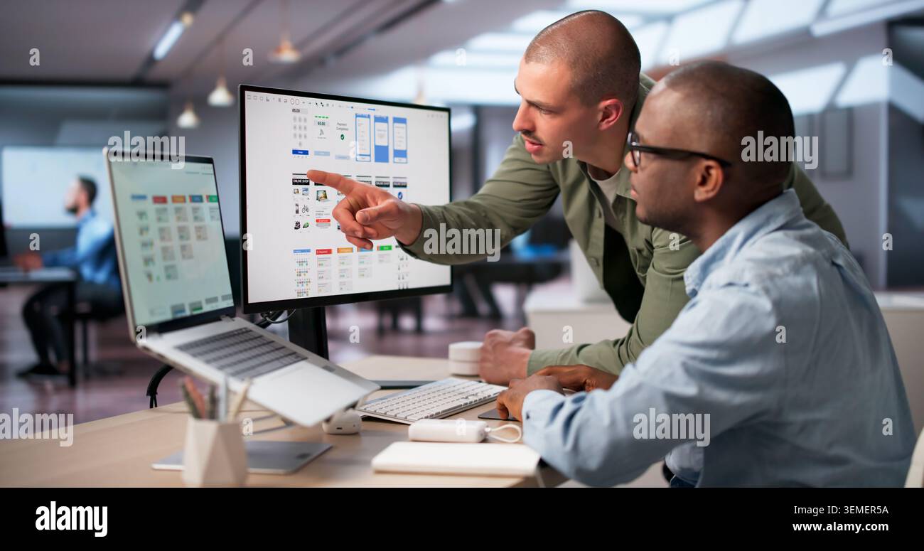 Creative UX Designers Working Together To Improve App Interface Design. Stock Photo