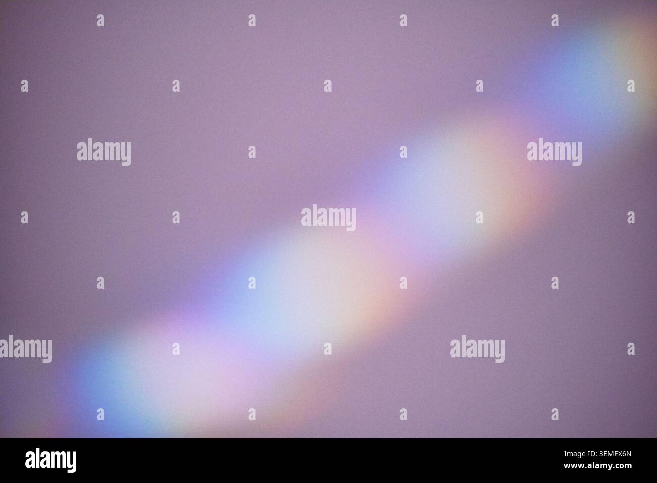 Light refracting into colorful spectrum forming abstract background with soft focus gradient Stock Photo