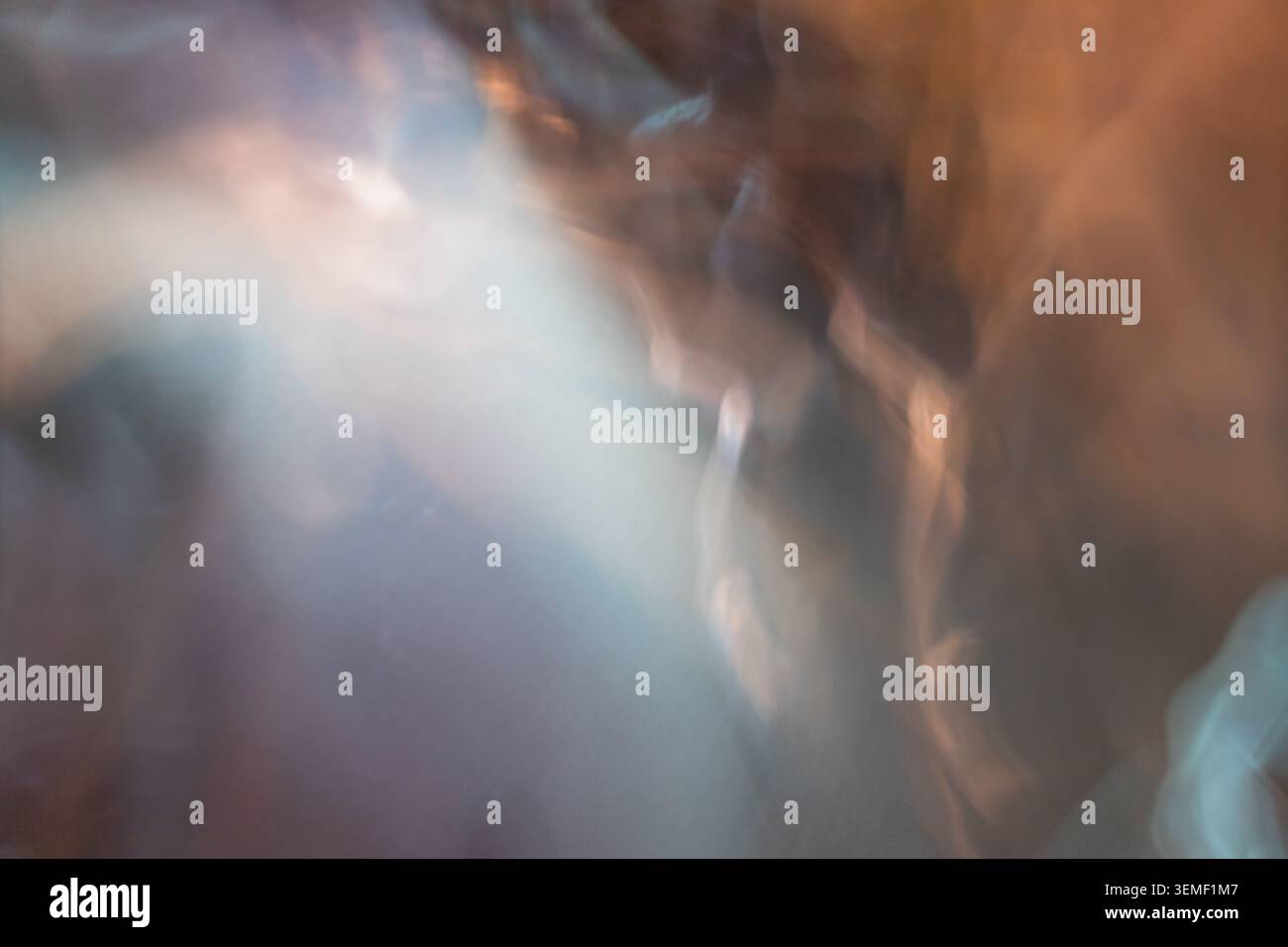 Abstract blurred background with warm and cool light leaks Stock Photo