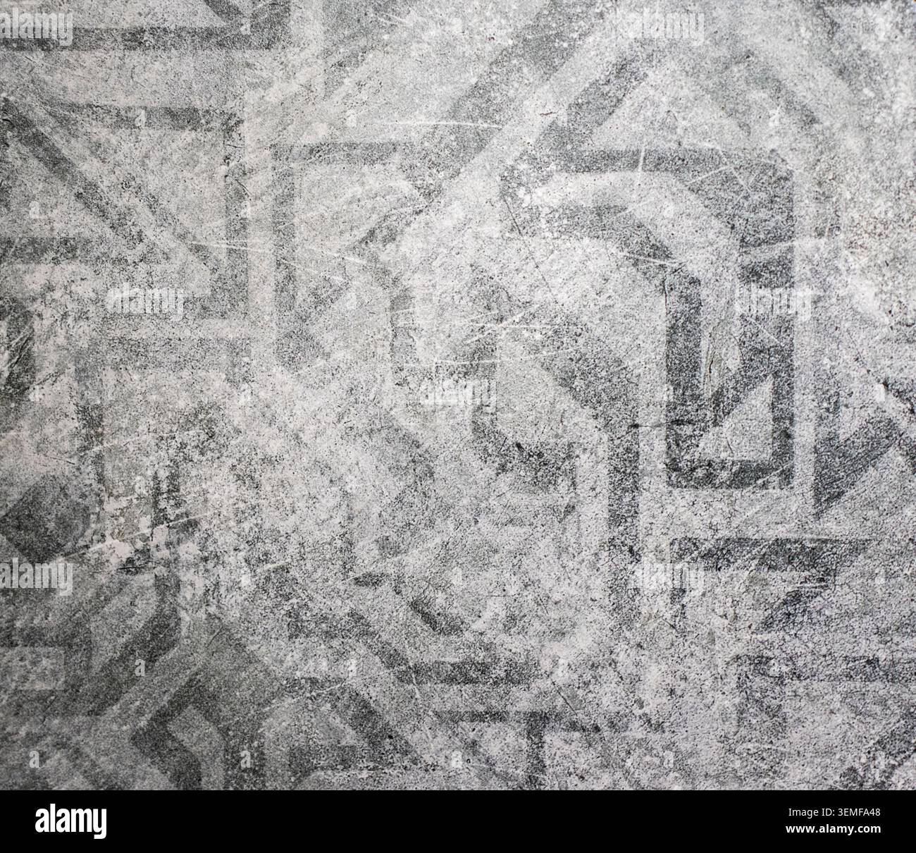 Distressed Ancient Geometric Pattern on Light Gray Background Texture Stock Photo