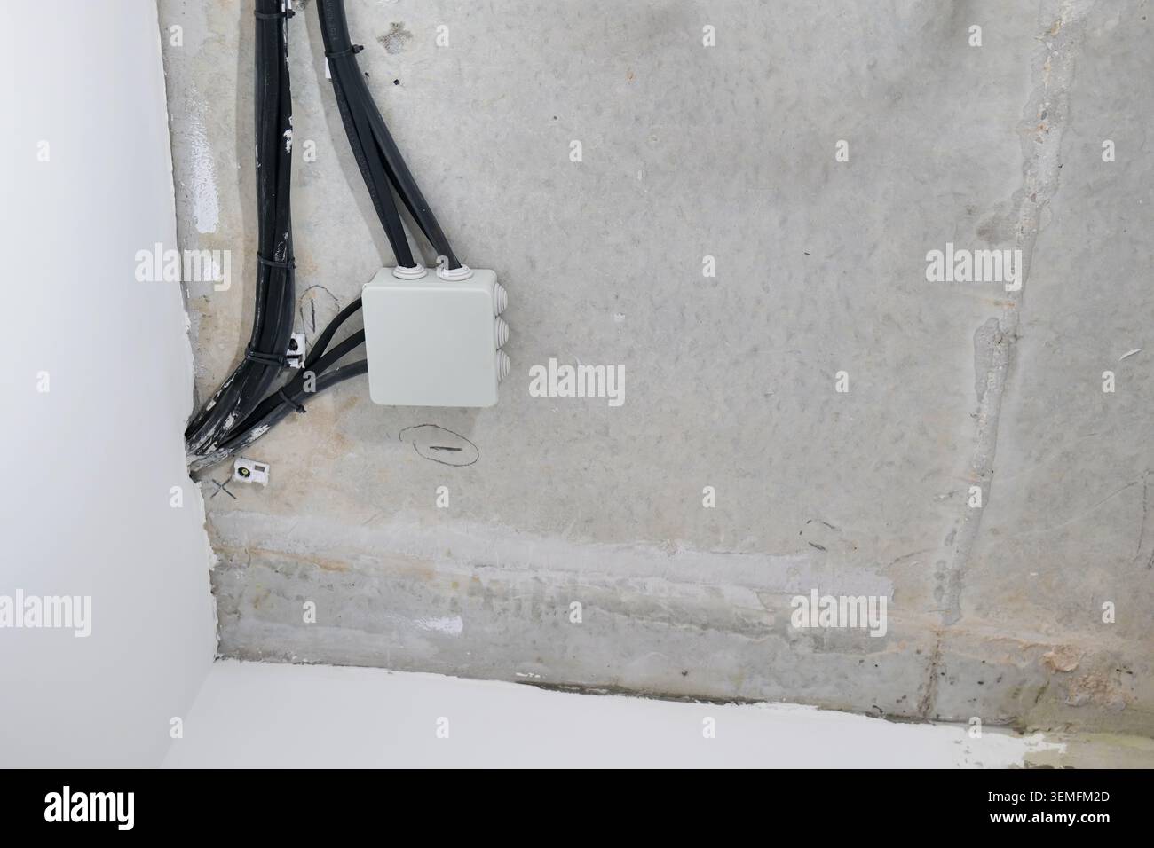 Electrical junction box and wires on concrete ceiling Stock Photo