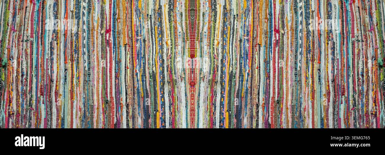 vibrant multicolored rag rug, handwoven from cotton fabric scraps Stock Photo