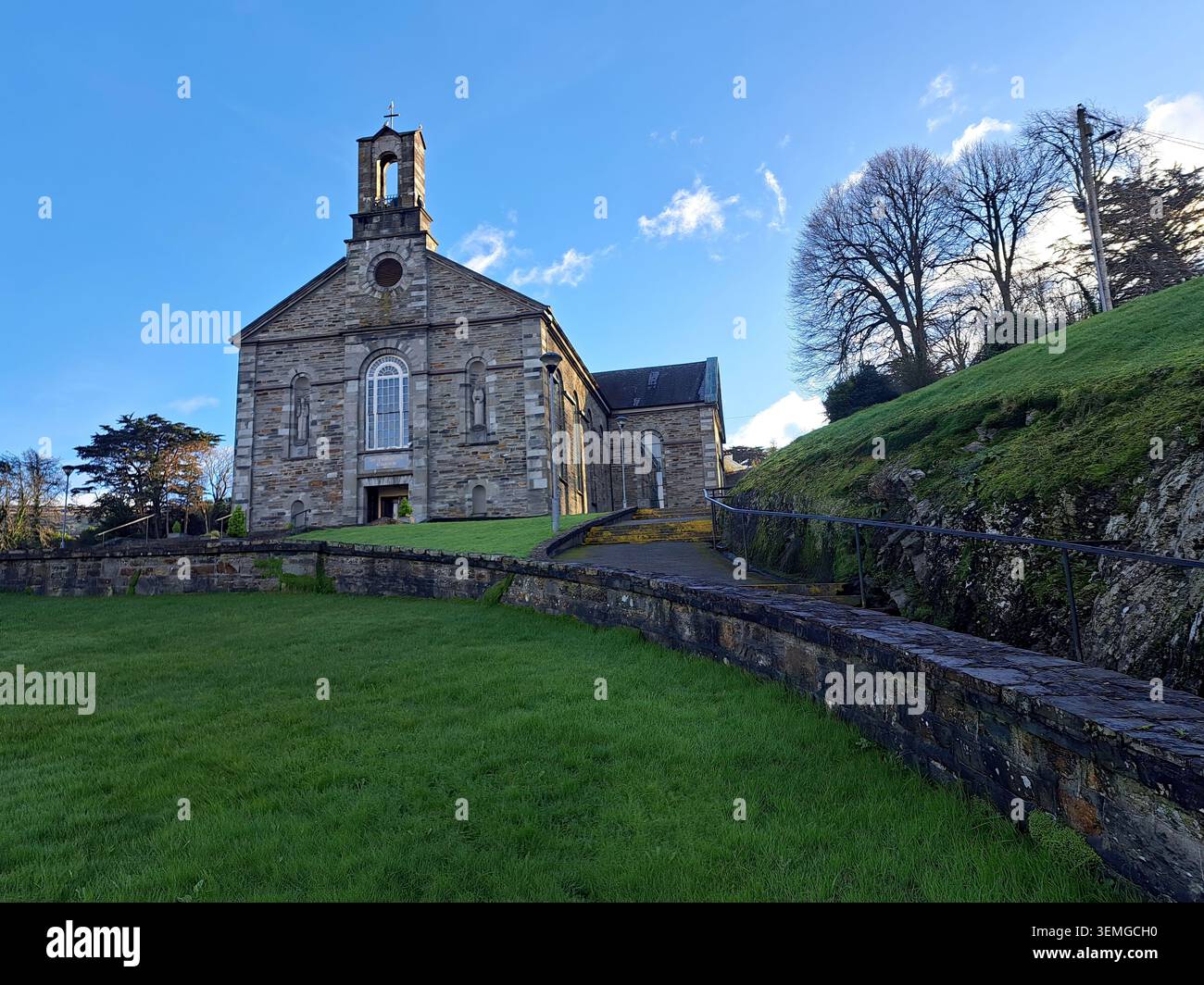Freestanding cruciform-plan double-height gable-fronted Roman Catholic church, built 1826, having three-bay entrance front with central breakfront, fo - Smartphone Captured Stock Image