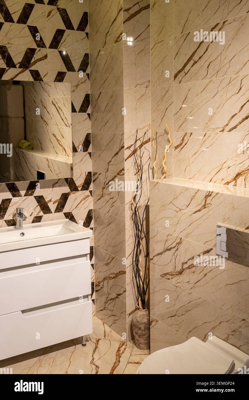 Modern Grey Bathroom Interior with Floating Vanity and Patterned Tiles Stock Photo