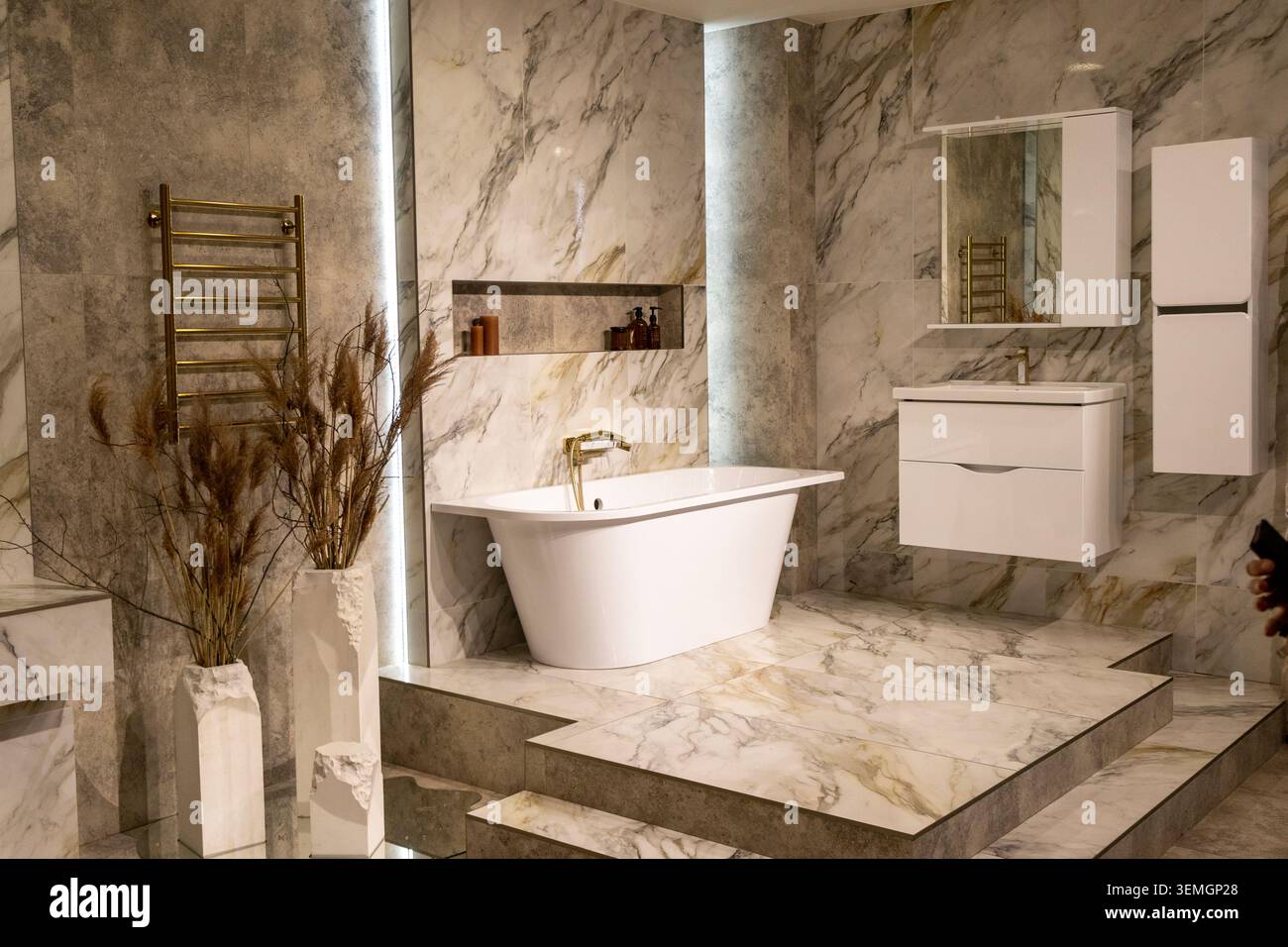Luxury Bathroom Interior with Freestanding Bathtub and Gold Fixtures Stock Photo