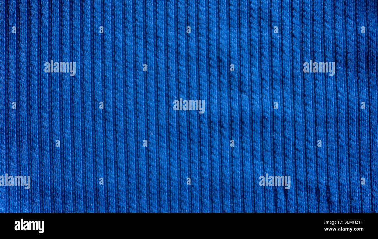 Dark blue ribbed corduroy fabric texture background with vertical lines pattern for fashion design Stock Photo