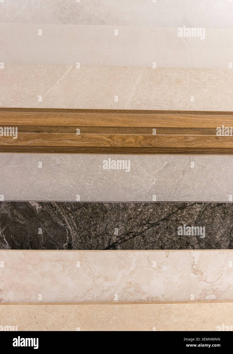 Contemporary Tile Selection Featuring Wood Accent Profiles and Marble Patterns Stock Photo