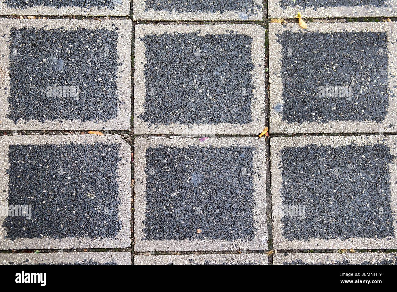 Stone pavement texture. Granite cobblestoned pavement background. Abstract background of a cobblestone pavement Stock Photo