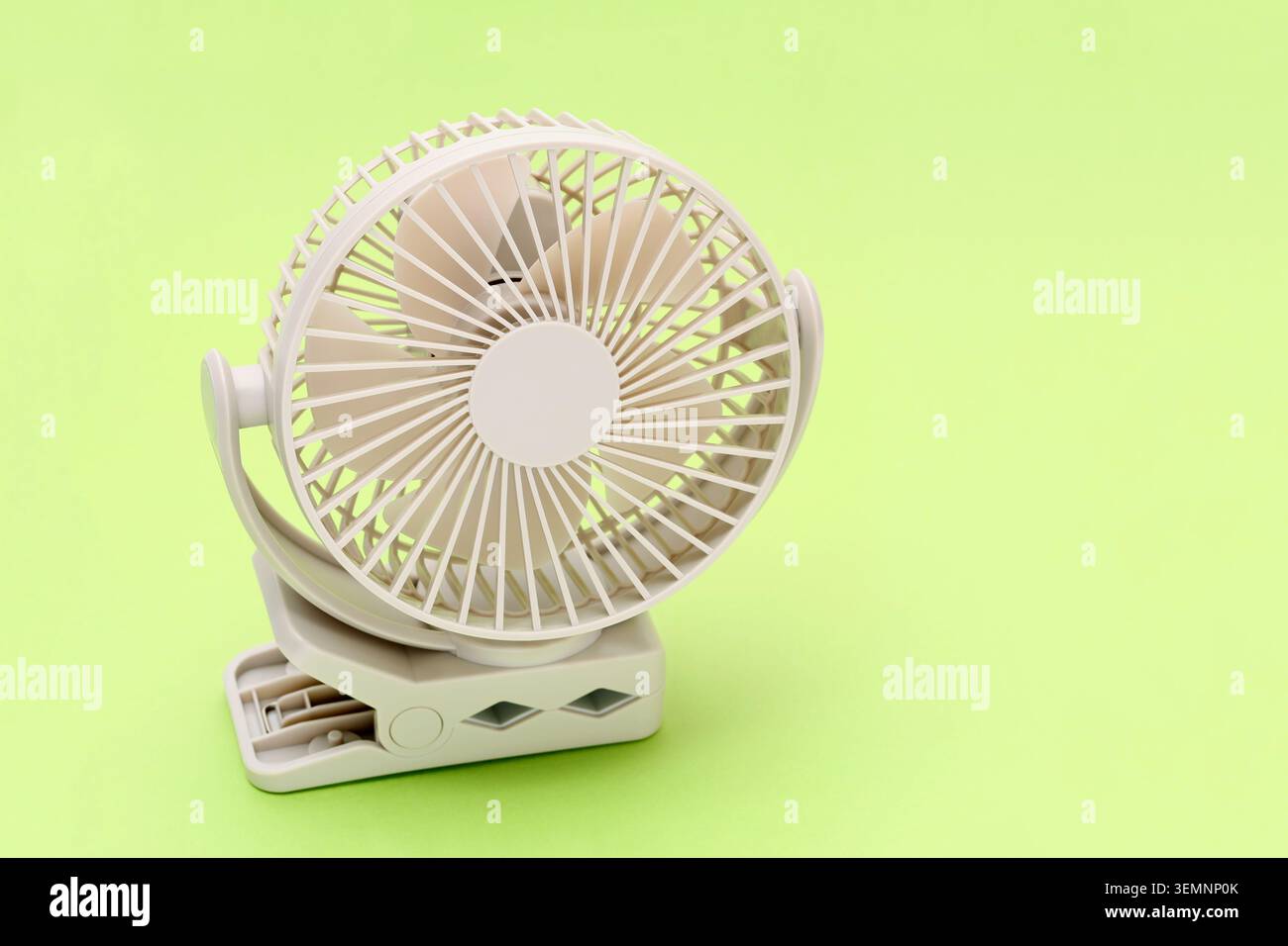 rechargeable portable small fan on a table background Stock Photo