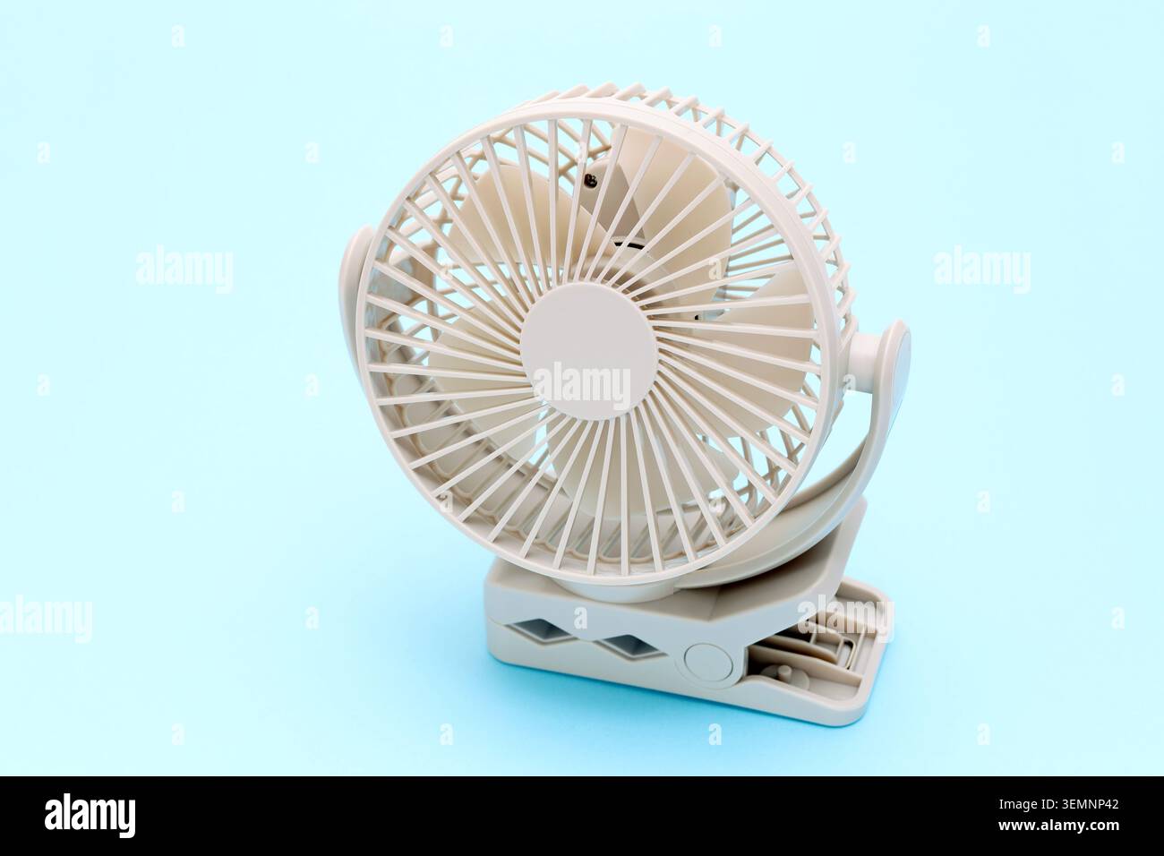 rechargeable portable small fan on a table background Stock Photo