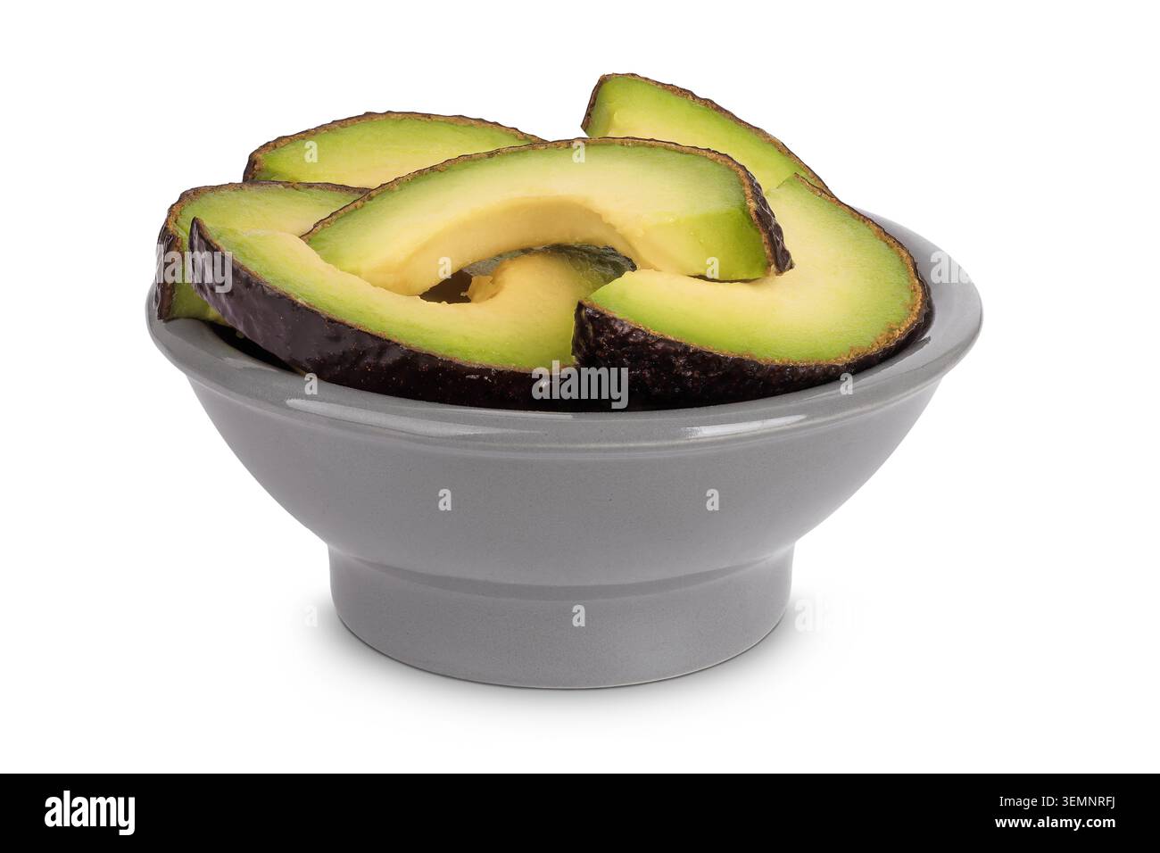 avocado slices in ceramic bowl isolated on white background close up Stock Photo