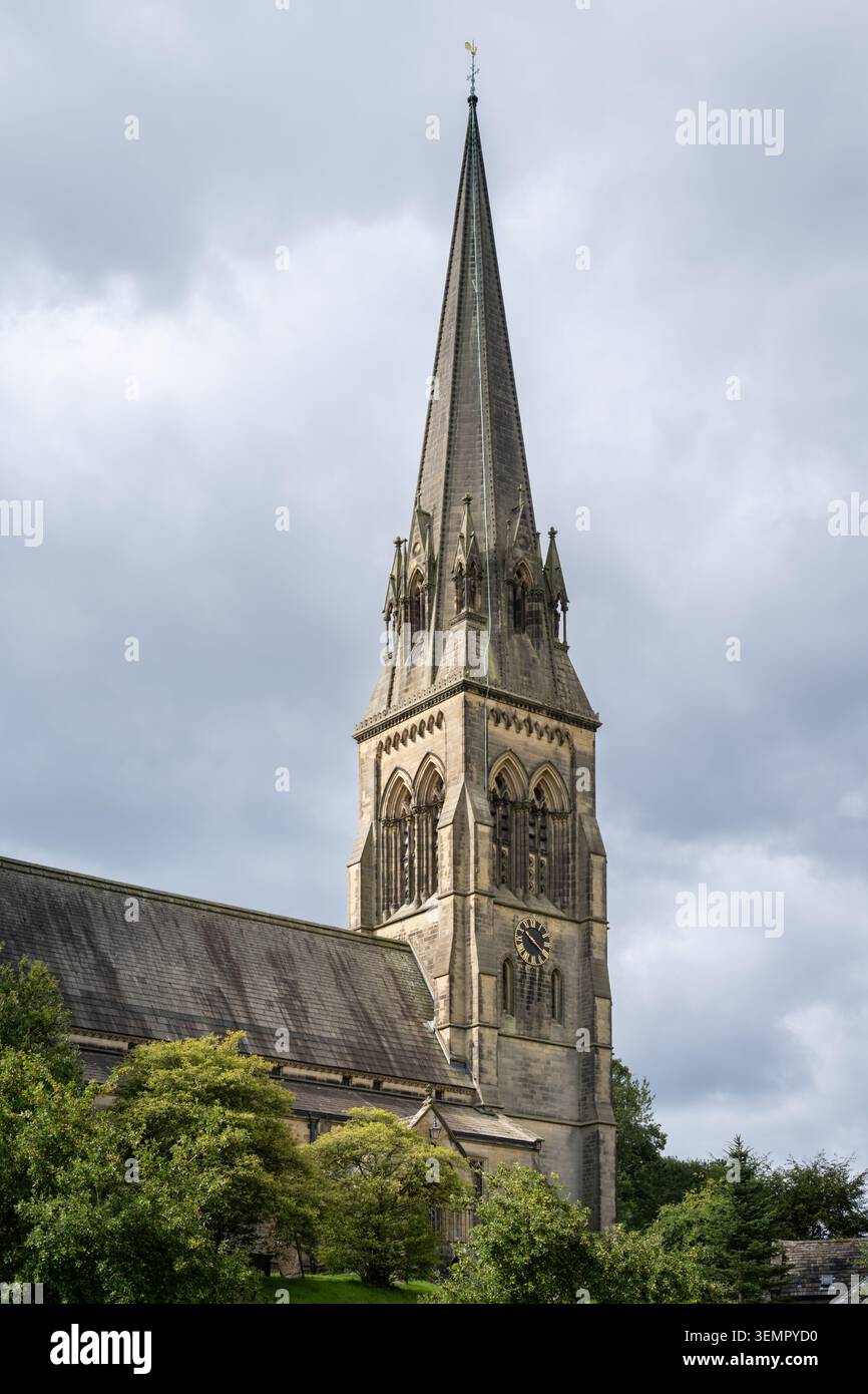 A dramatic, vertical low-angle view emphasizing the soaring Gothic Revival steeple Stock Photo