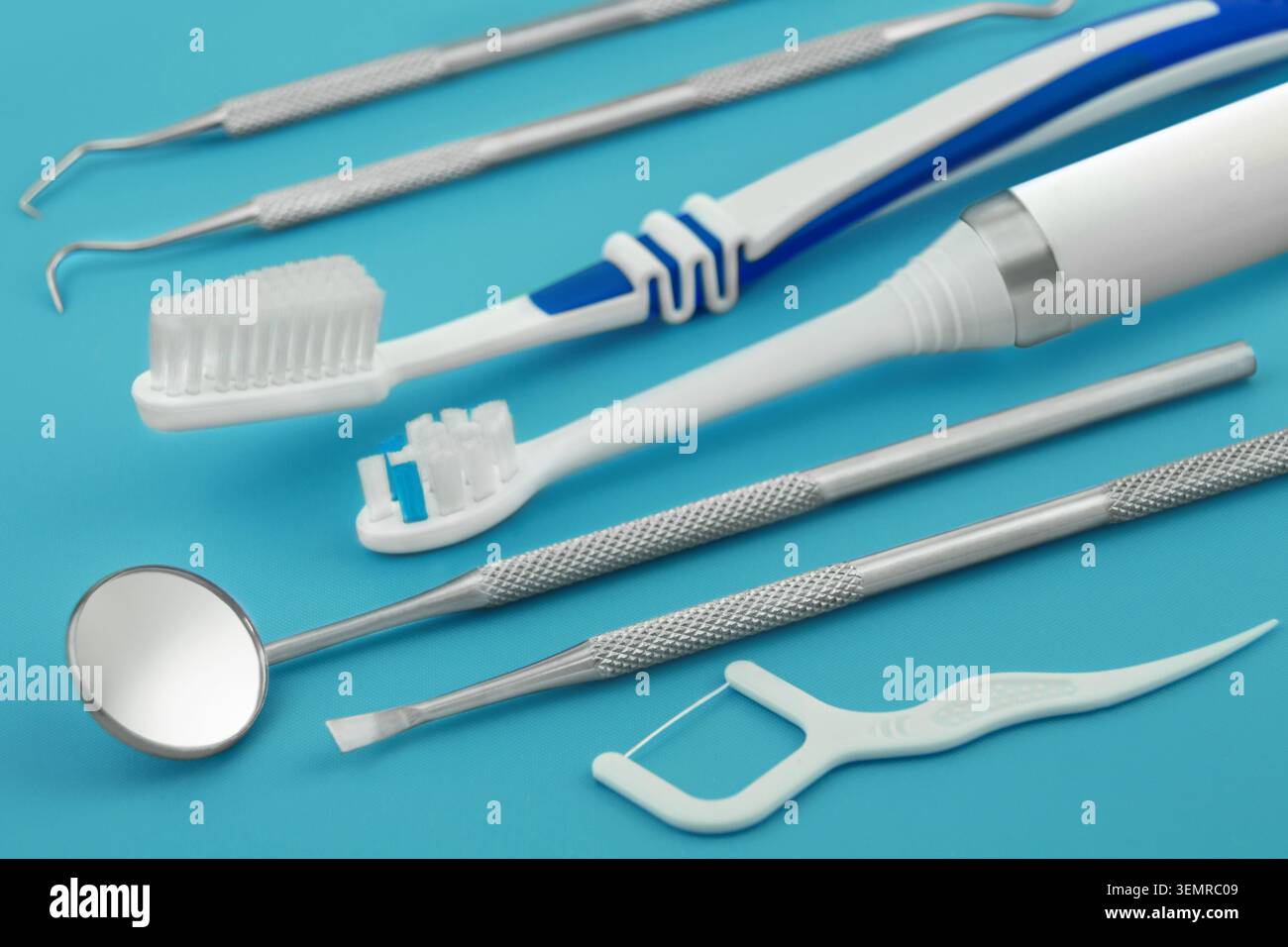 Dental care tools and products on blue background Stock Photo