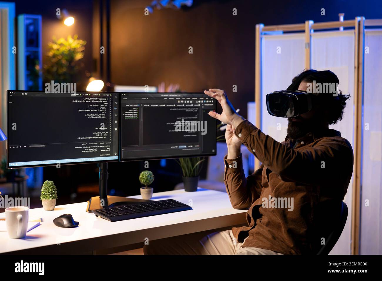 Programmer using high-tech VR headset to secure company servers from virus attacks, with IT remote employee building firewalls protecting data using futuristic virtual reality technology. Stock Photo