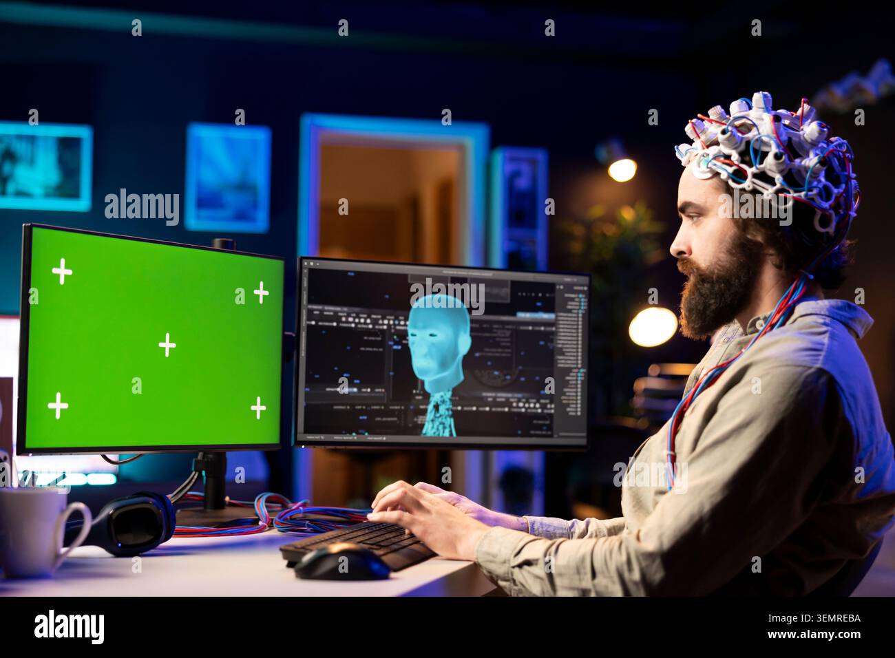 Software engineer with EEG headset starting mind upload on green screen PC, trying to gain bionic powers, with IT admin using high-tech neuroscientific gear and mockup computer. Stock Photo