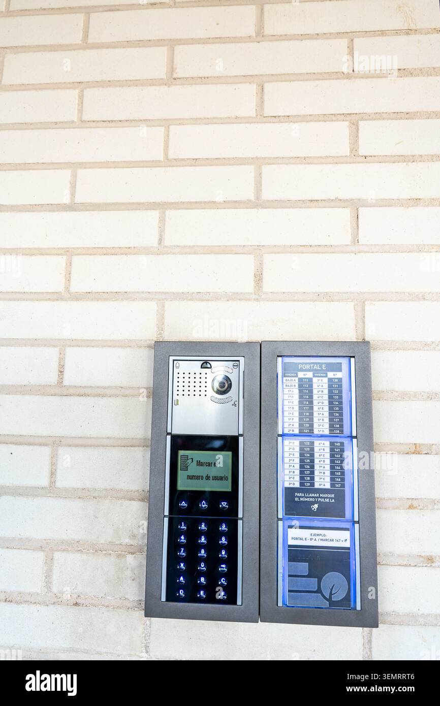 Modern intercom system with digital directory and keypad for apartment building entry security Stock Photo