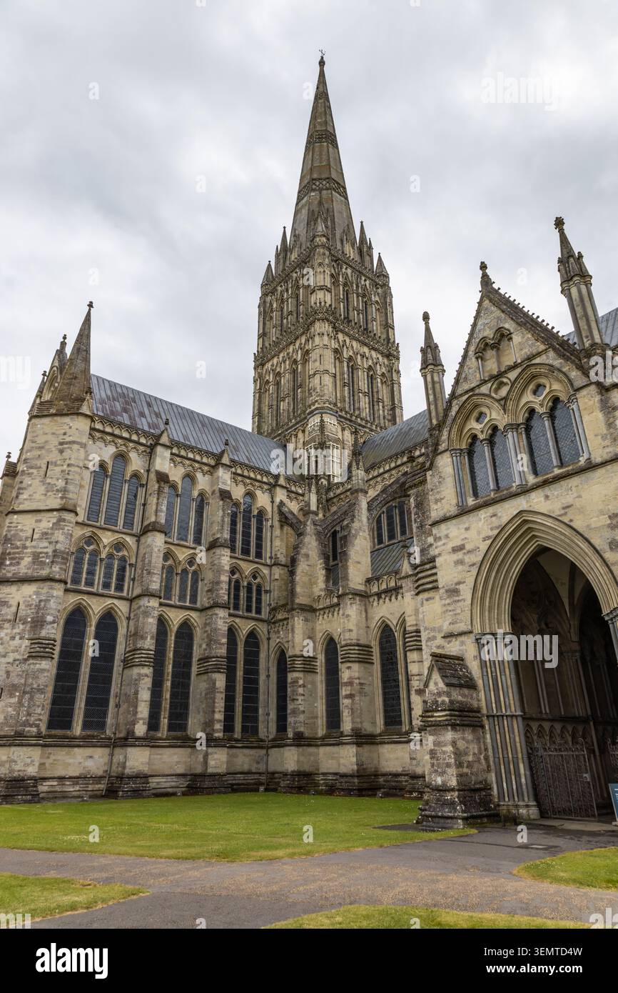 Salisbury Cathedral spire rising into a cloudy sky in Wiltshire Stock Photo