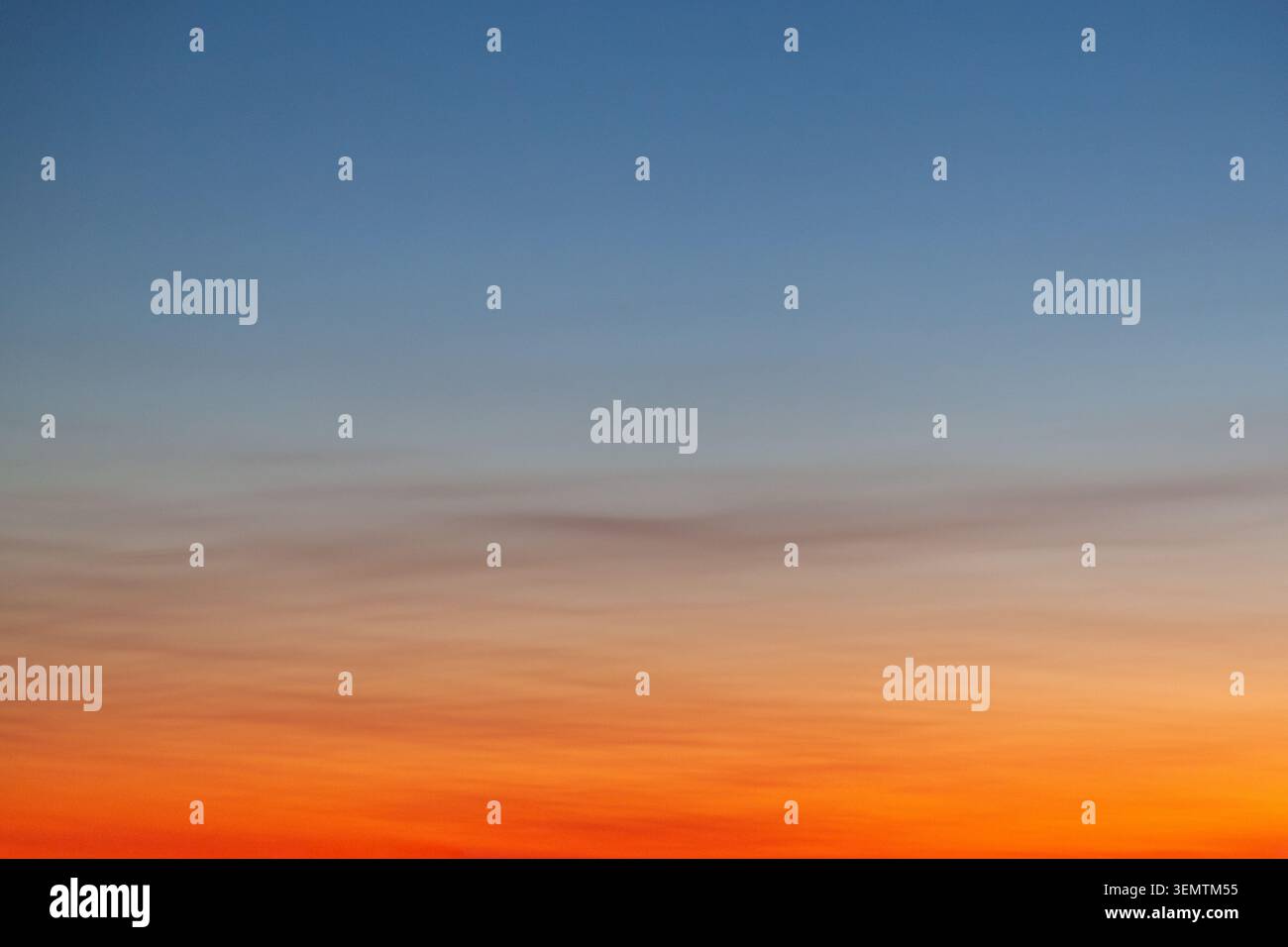 Clear and empty blue and orange gradient sky for background, horizontal image Stock Photo