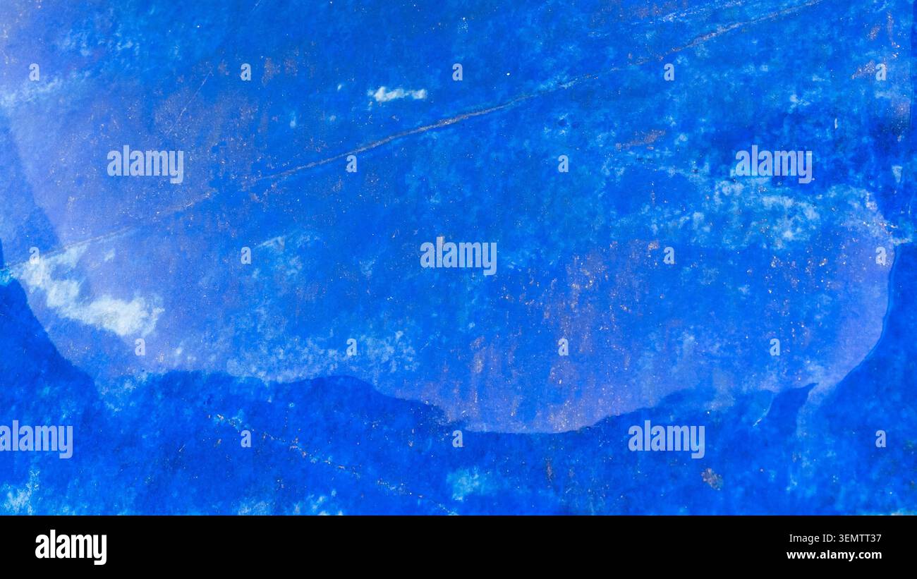natural mineral panoramic background - surface of polished dark blue lapis lazuli rock close-up Stock Photo