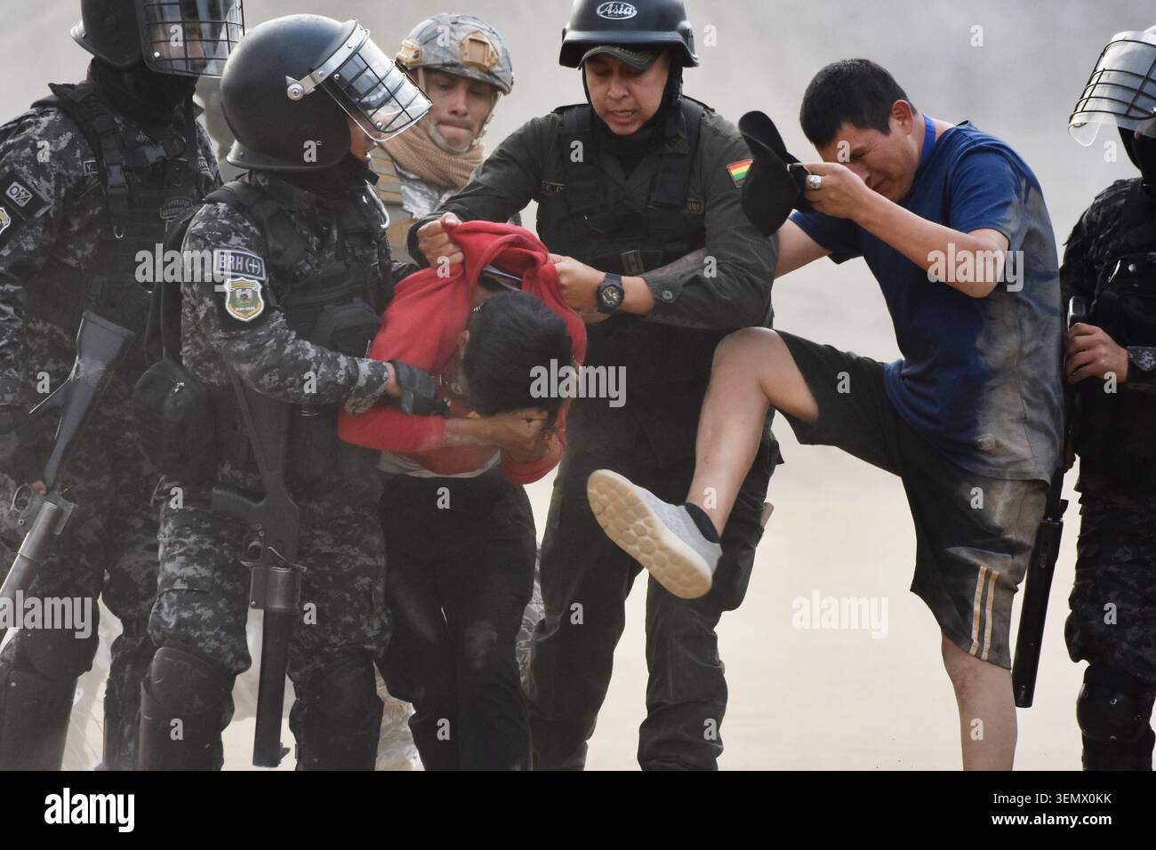 Police detain demonstrators during an anti-government protest in Vinto ...