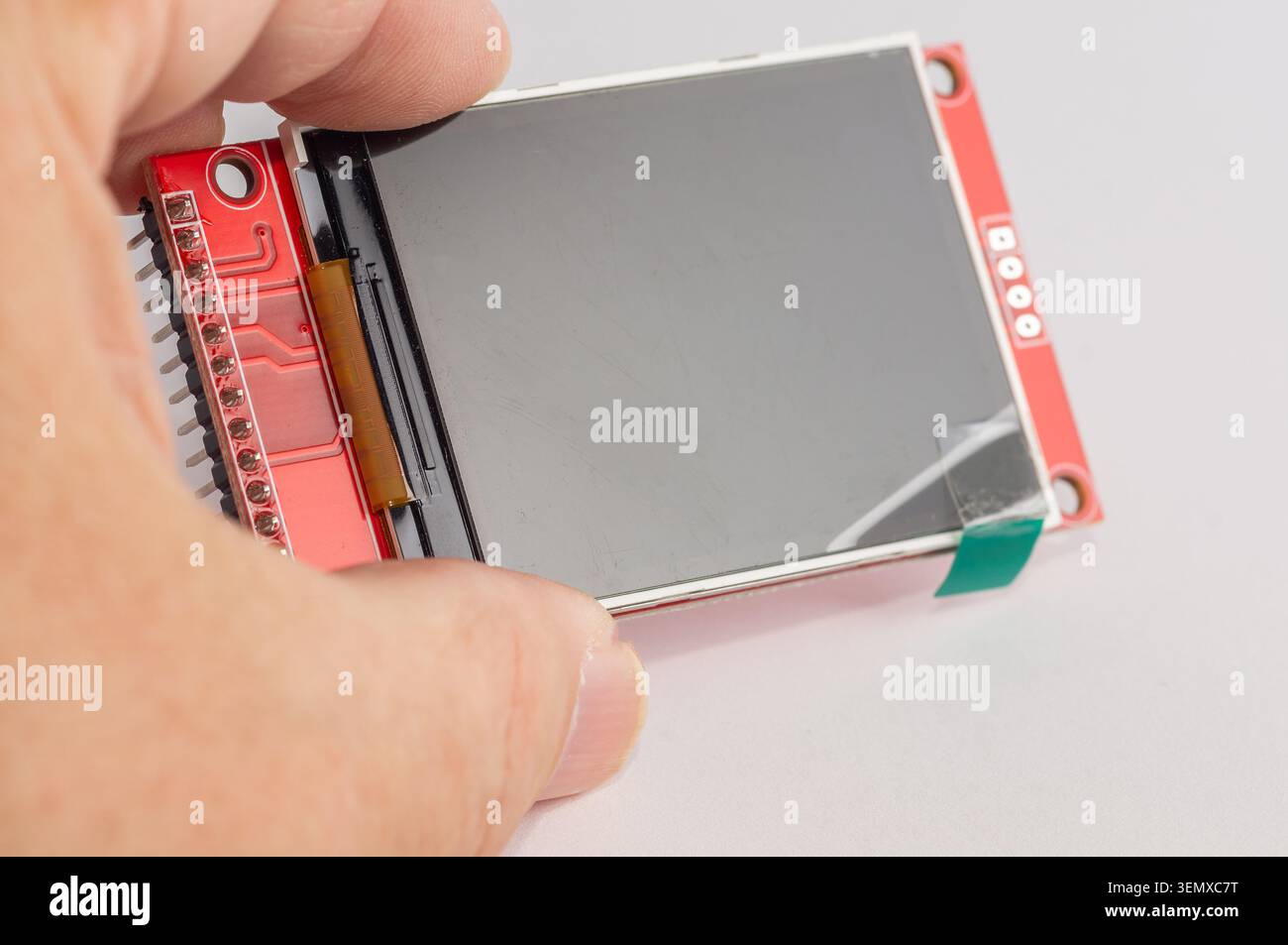 Close-up of an OLED display for microcontroller devices held in a hand. Stock Photo
