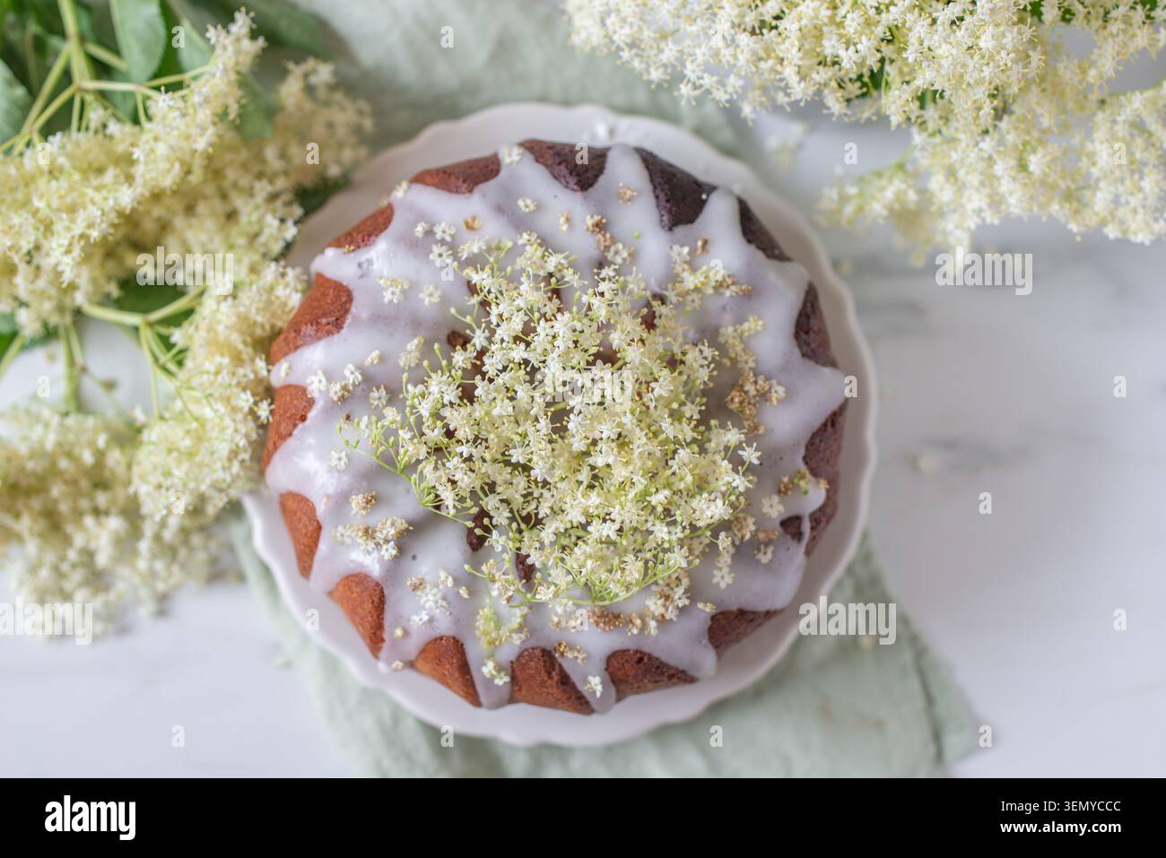 home made elderflower bundt cake with raspberries Stock Photo