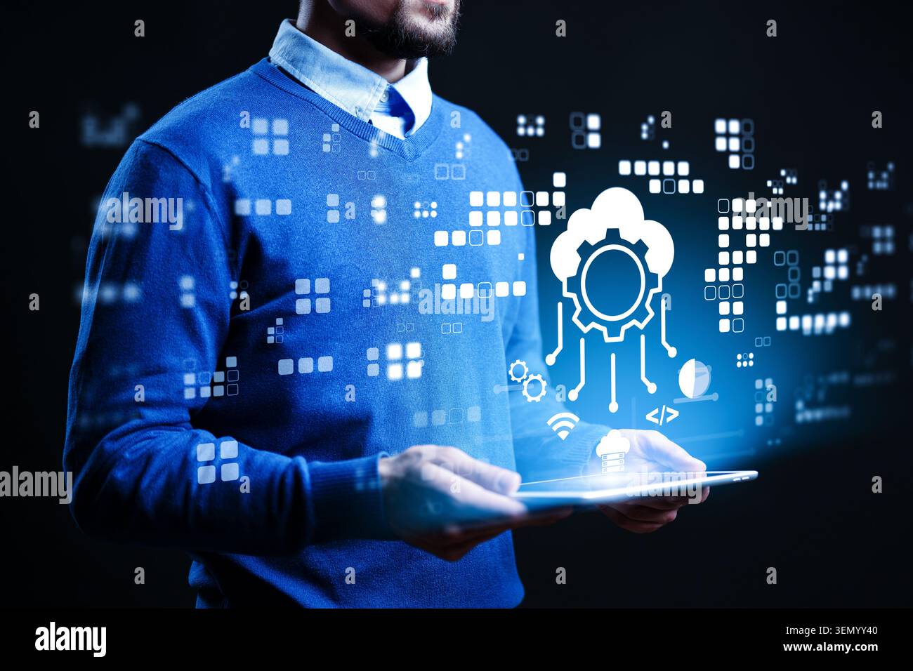 Man holds tablet and interacts with cloud and data graphics in digital space Stock Photo