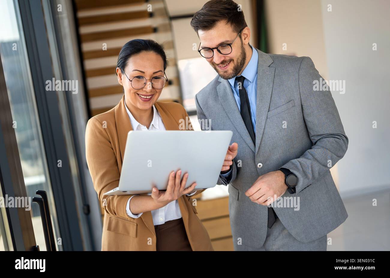 Mixed team of software engineers brainstorming ideas. Diverse app developers collaborating as group Stock Photo