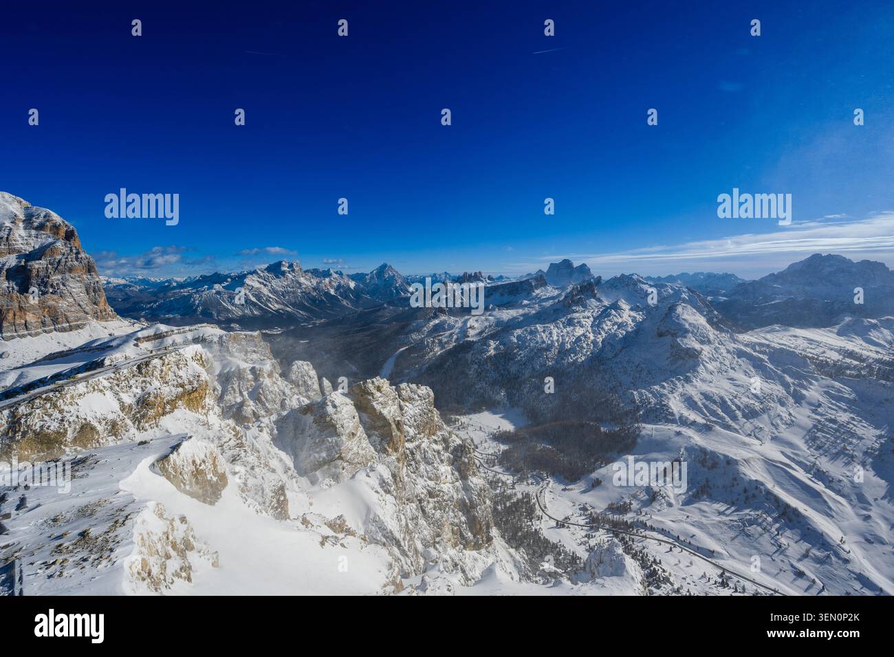Snow-covered mountain range under a deep blue sky. Stock Photo
