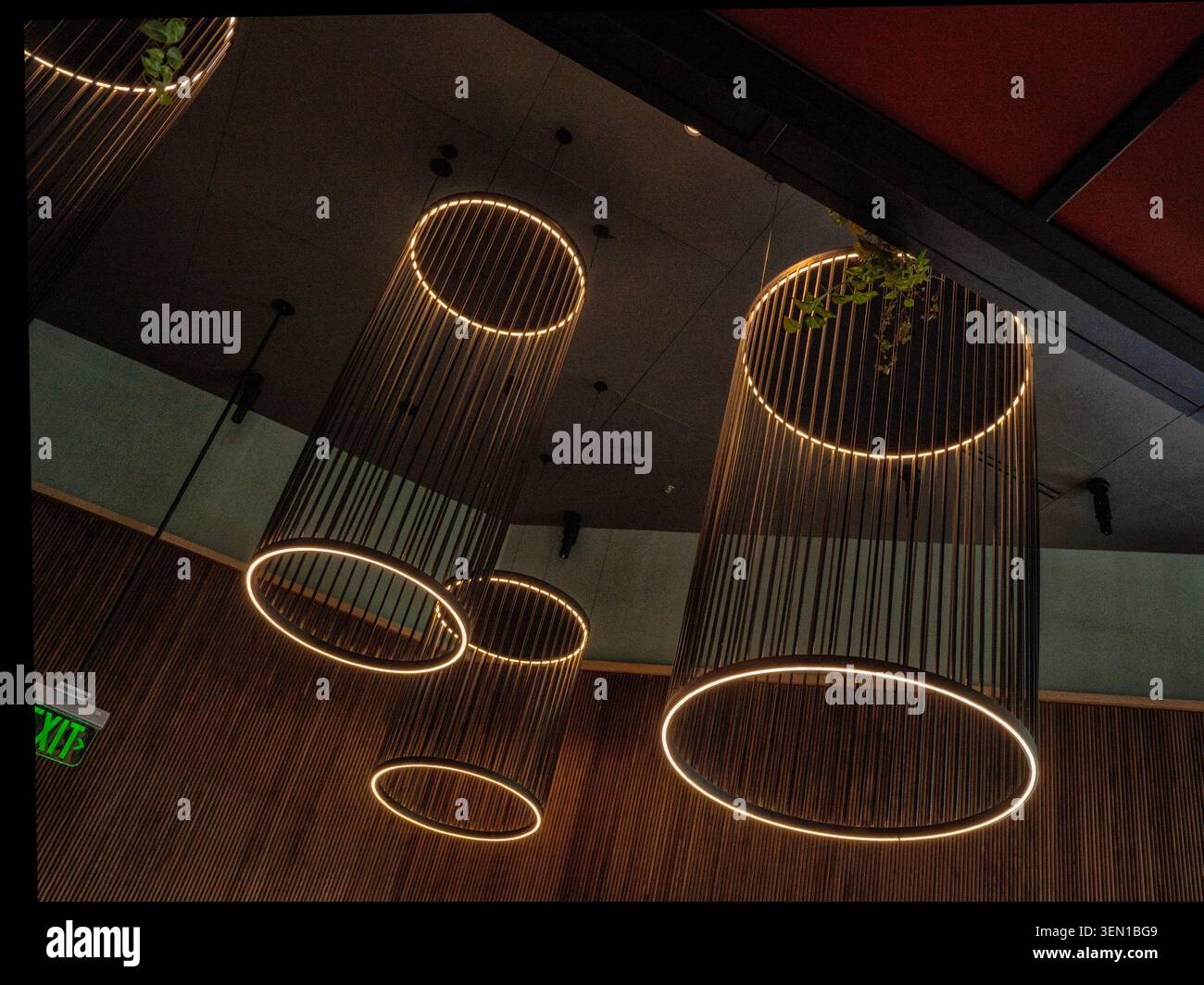Dramatic ceiling lighting reflected onto a dark marble surface Stock Photo