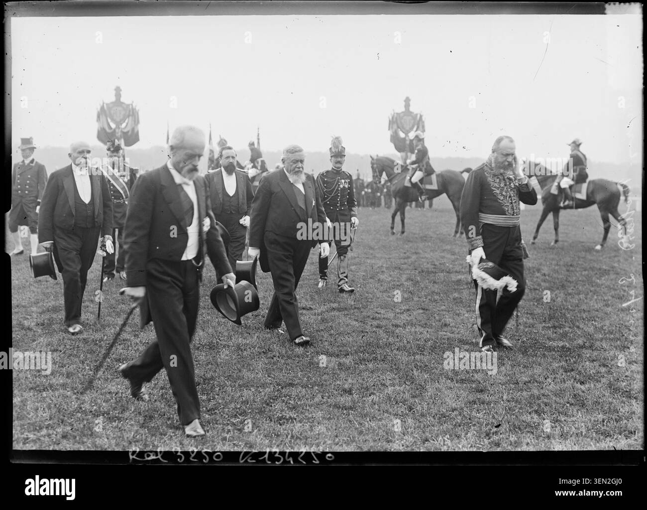 On 14 July 1907, Armand Fallières proceeds to present decorations during a Paris parade attended by Armand Mollard, Louis Lépine, and Georges Clemenceau. The press photograph by Agence Rol records the ceremonial occasion. Stock Photo