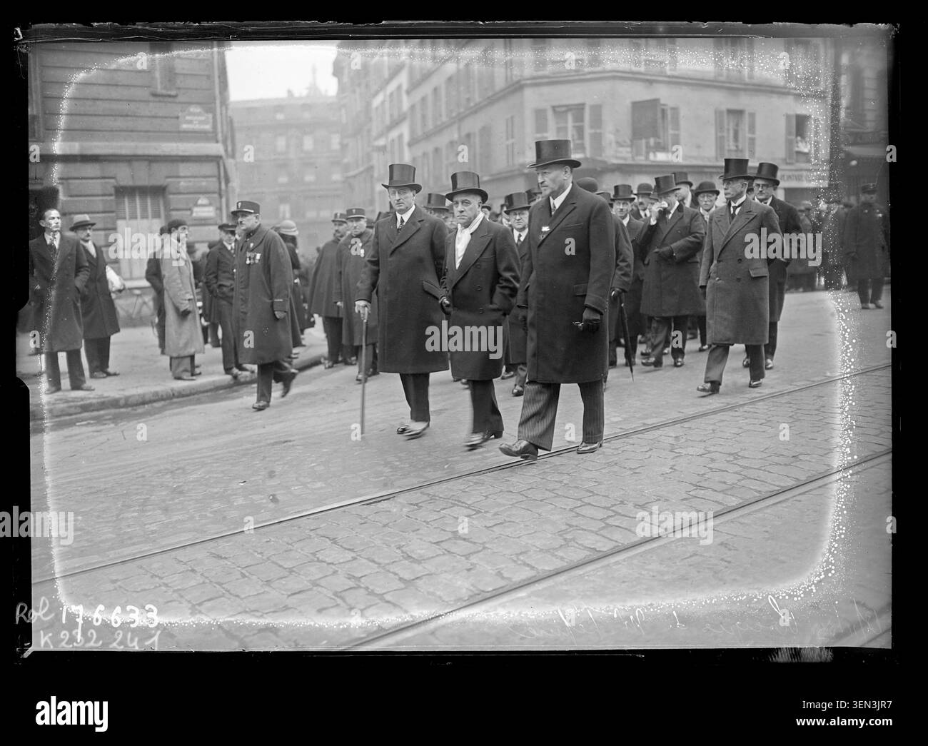 The funeral procession of Louis Lépine moves along Boulevard du Montparnasse in Paris on 13 November 1933. The press photograph records participants in the funeral rites and ceremonies held following the death of the French public figure. Stock Photo