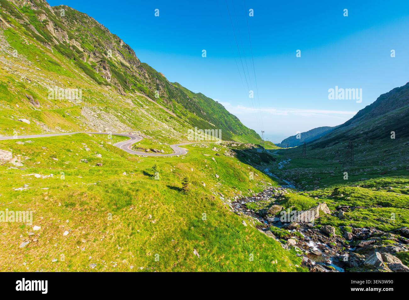 Transfagarasan road through mountains winding uphill. popular highway travel destination of Romania. nice view of mountain on summertime weather. road Stock Photo