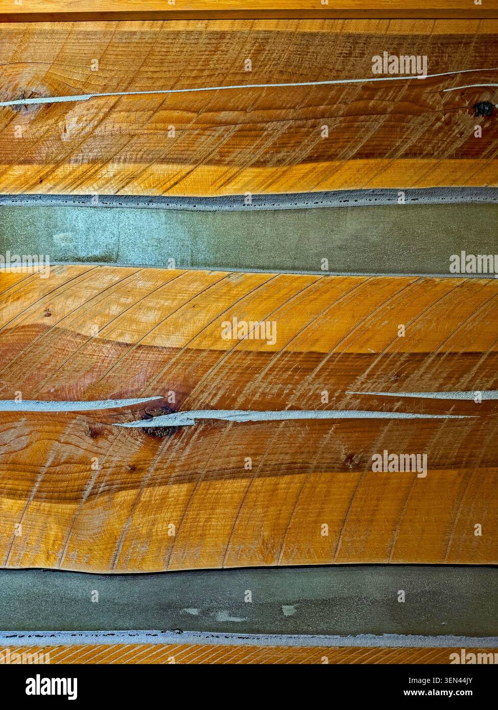 Abstract Log Cabin Inside Wall with Chinking and Saw Marks Stock Photo