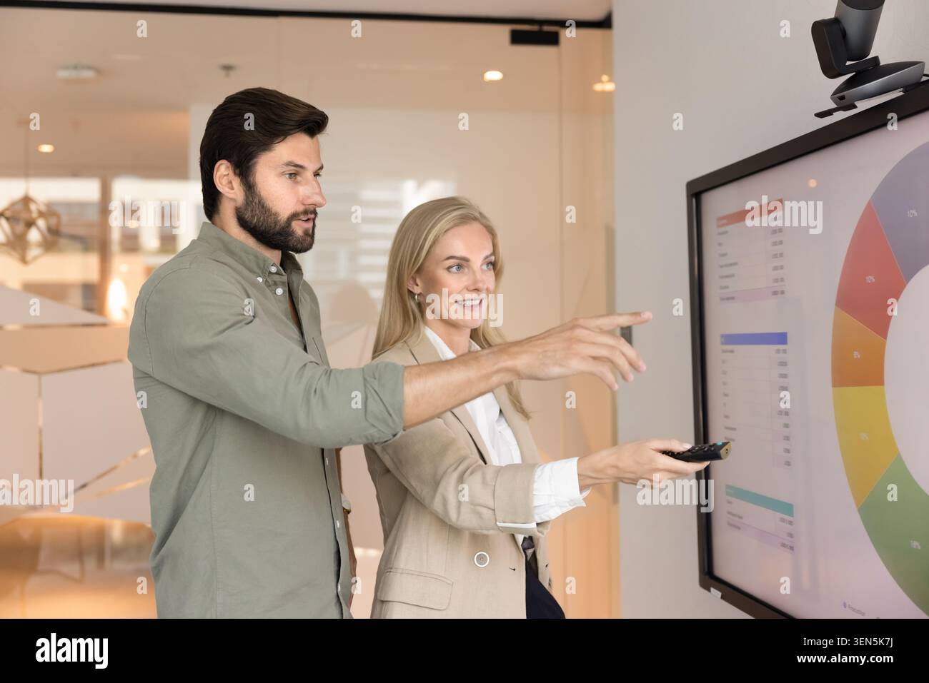 Colleagues brainstorming, exchanging ideas, engaged in teamwork Stock Photo