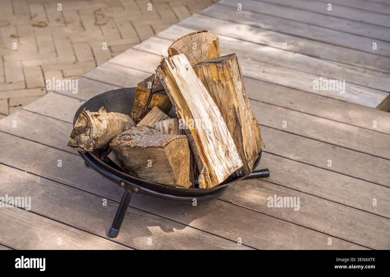 Stone fire pit in the backyard. Empty space for text. Stock Photo