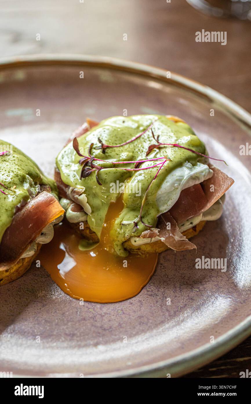 Gourmet eggs benedict with prosciutto Stock Photo