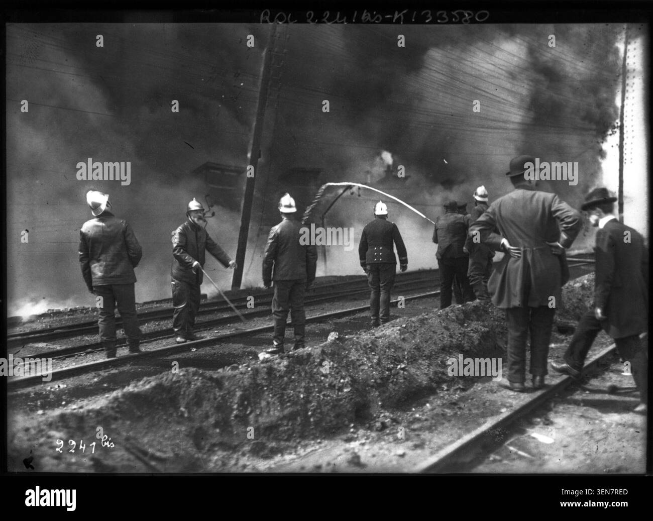Louis Lépine appears in firefighter uniform in this 1908 press photograph commissioned by Agence Rol. The monochrome portrait records the police prefect with protective helmet and fire service equipment associated with firefighters. Stock Photo