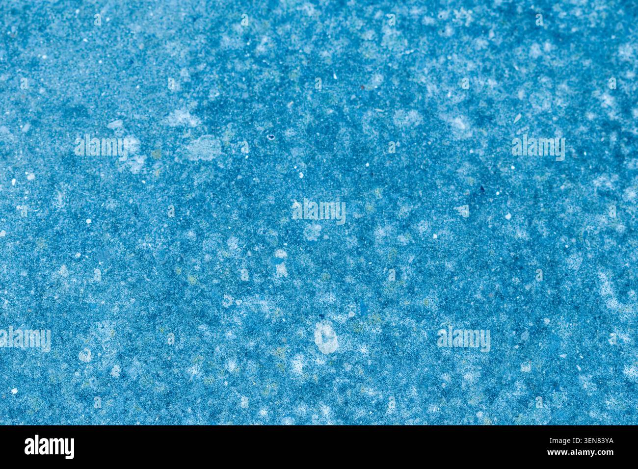 Abstract teal texture with mottled pattern and white speckles Stock Photo