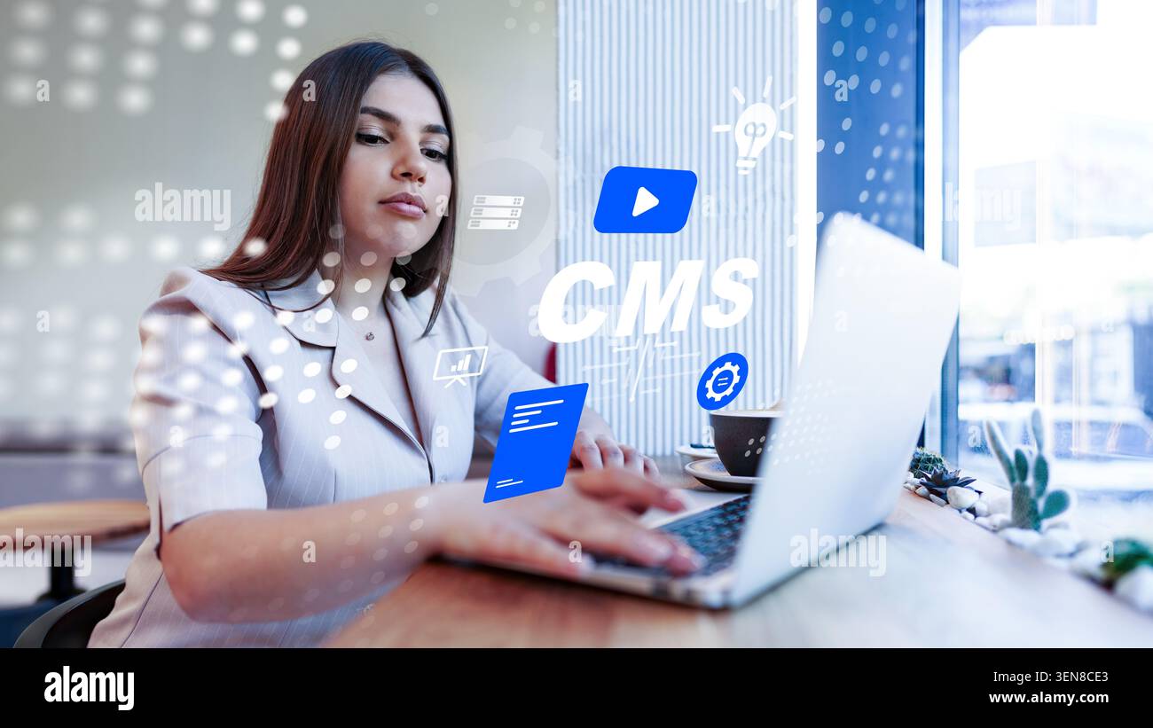 Woman using computer to manage content in a system at a modern workspace Stock Photo