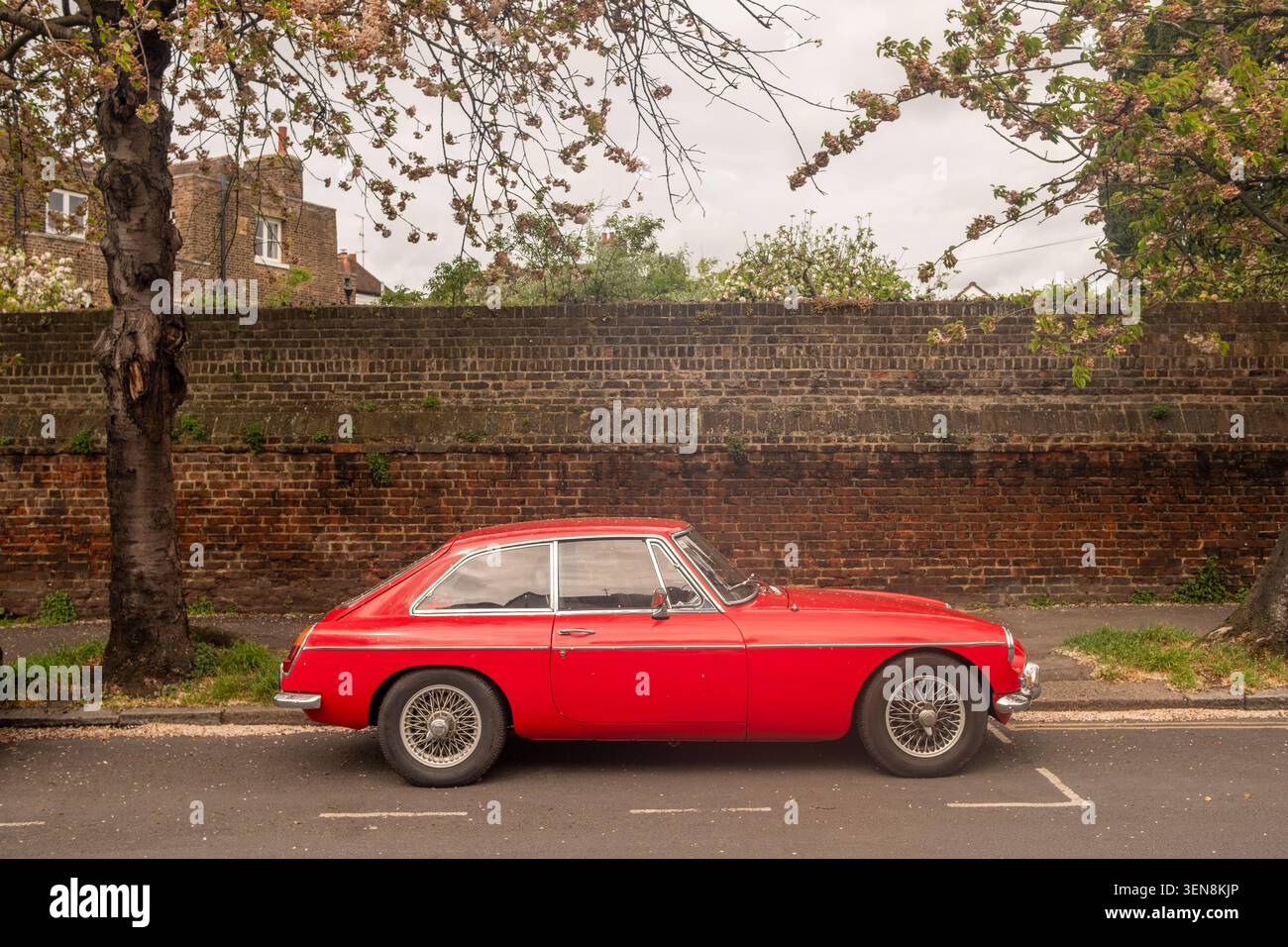 LONDON - APRIL 16, 2026: CHISWICK – classic red MG B GT sports car Stock Photo