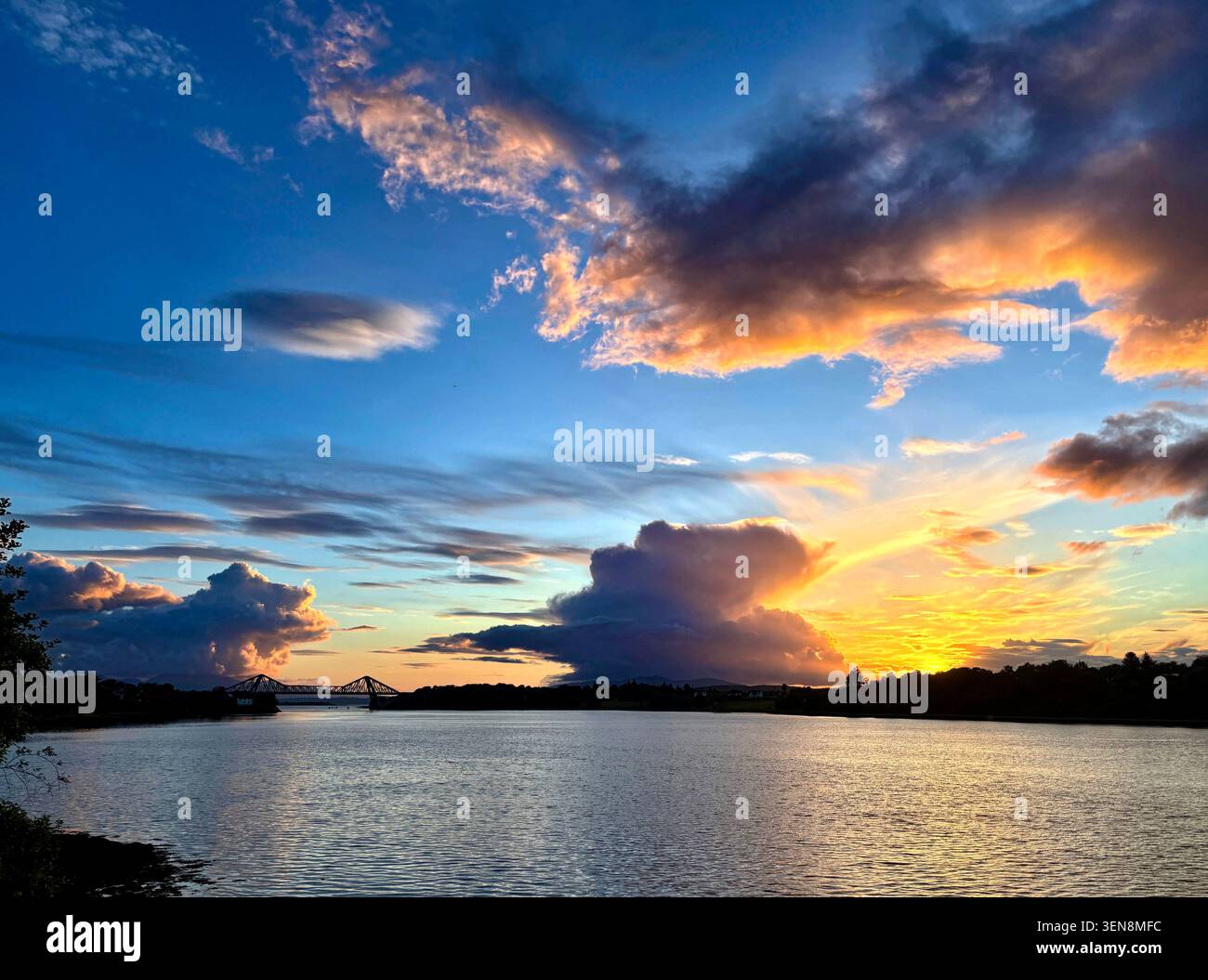 Dramatic clouds over Connel at sunset. Stock Photo