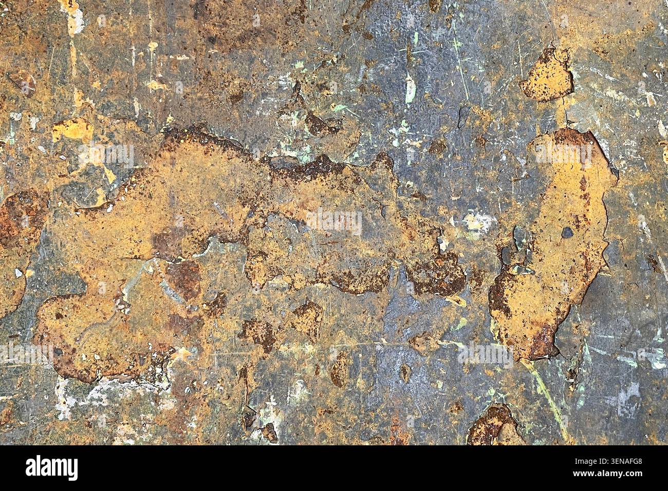 Weathered rusty metal surface texture closeup. Industrial background showing corrosion, peeling paint and material aging. Stock Photo