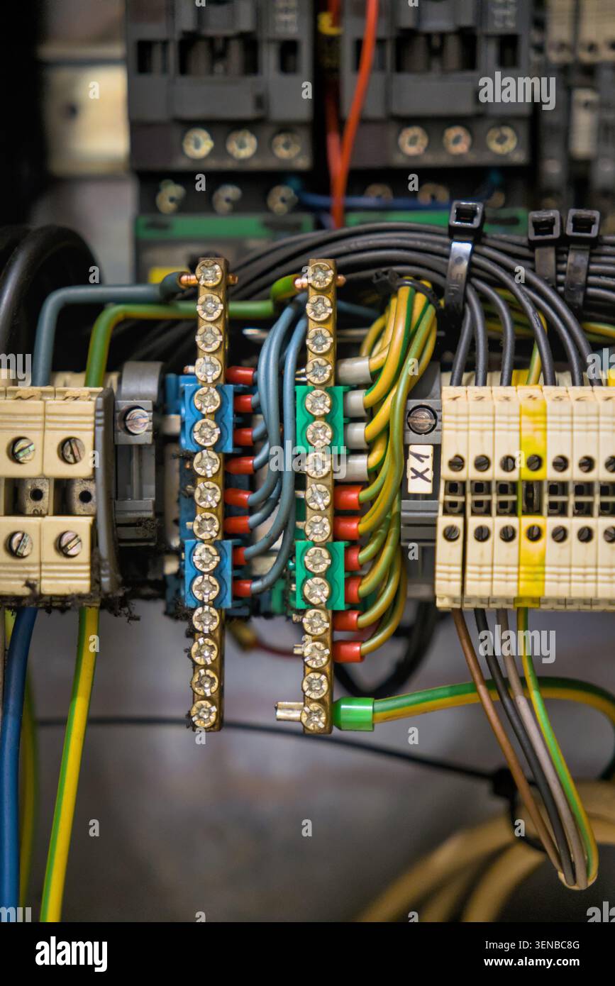 Industrial control panel wiring with terminal blocks and copper busbars Stock Photo