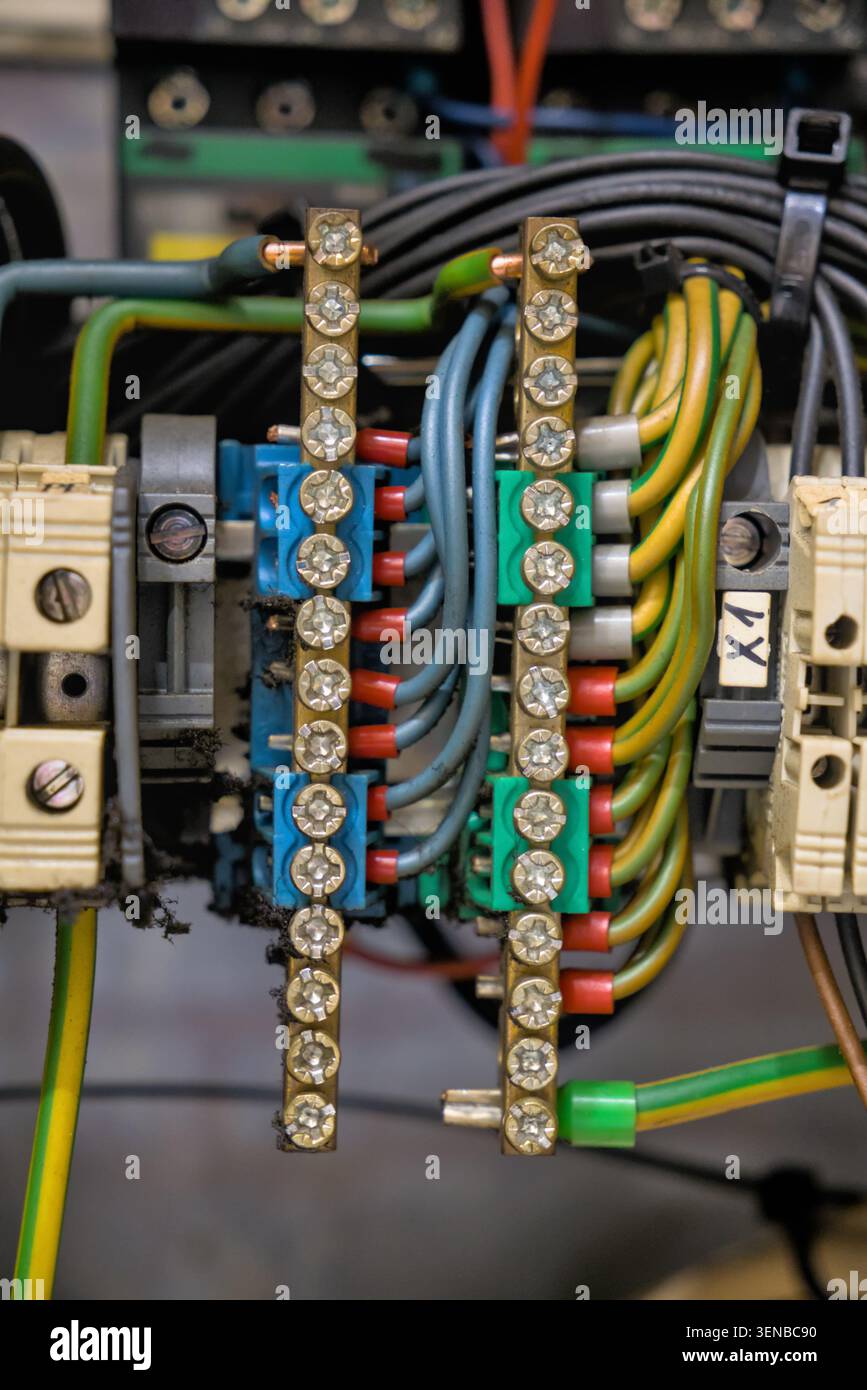 Industrial control panel wiring with terminal blocks and copper busbars Stock Photo