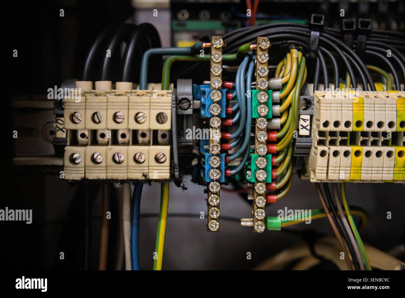 Industrial control panel wiring with terminal blocks and copper busbars Stock Photo