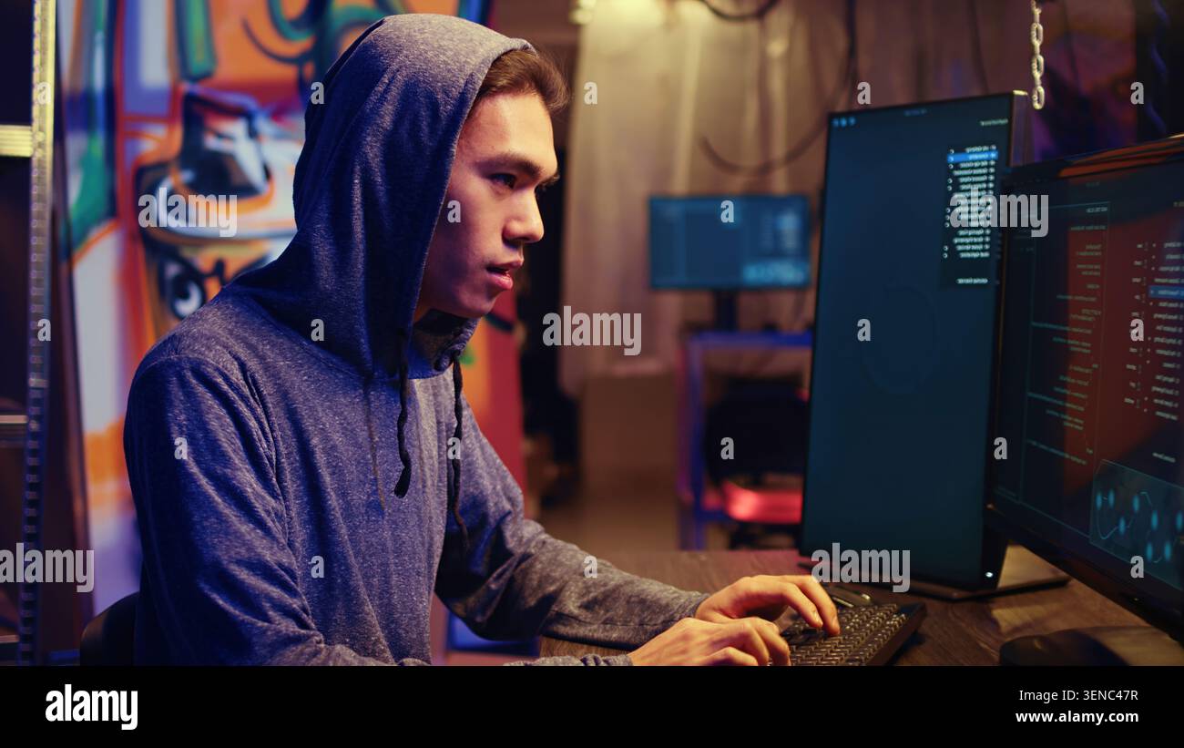 Hacker excited after finally developing zero day exploit undetectable by antivirus software installed on systems, Rogue programmer happy to successfully trick firewalls, close-up. Stock Photo