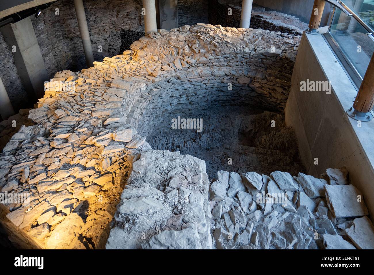Protection Stone Structure Excavated stone foundation and masonry pit under a protective structure ...